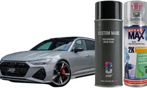 Elegancki samochód w kolorze nardo grey obok puszek z farbą w sprayu. Idealny do odświeżenia lakieru.